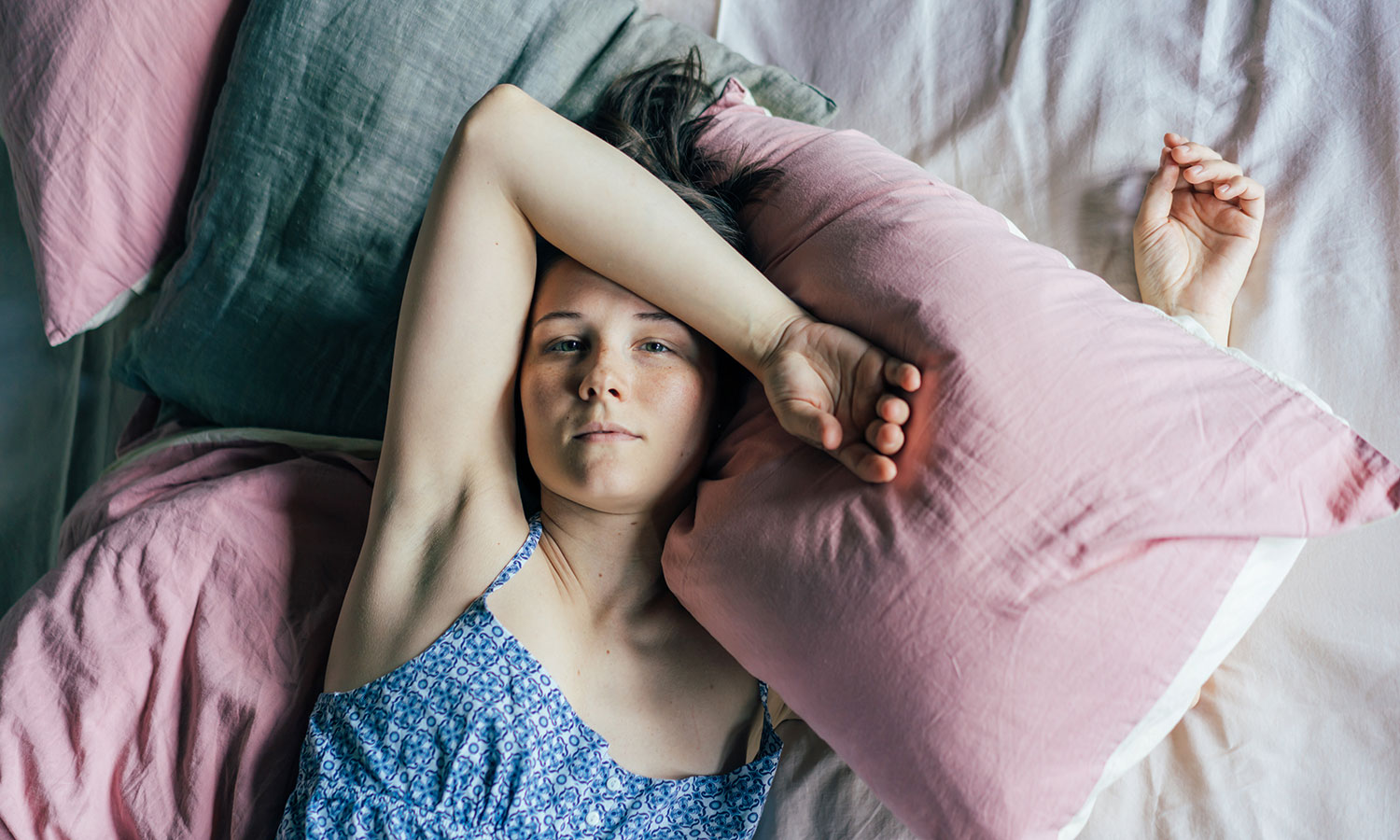 girl in bed waking up after trying sleep hack for bipolar depression