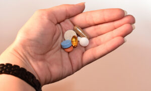 bipolar person with her meds in here hand